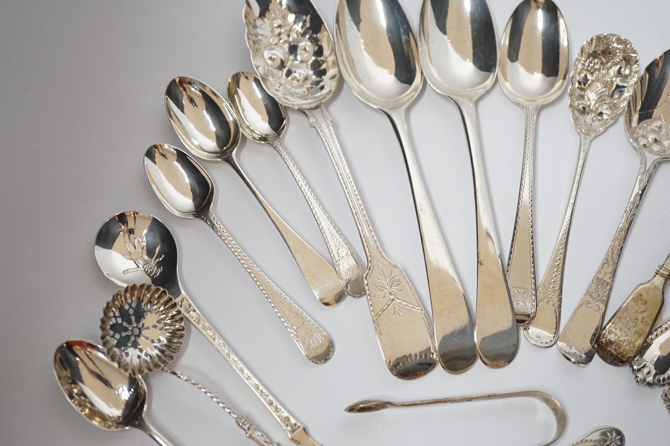 A quantity of assorted 19th century and later silver flatware, various dates and makers including base mark table spoons, berry spoons, sifter spoon etc. together with an Scandinavian 925 and enamelled spoon and a plated
